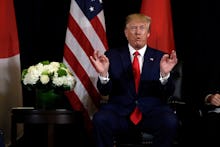 President Donald Trump talks while meeting with Japanese Prime Minister Shinzo Abe at the InterConti...