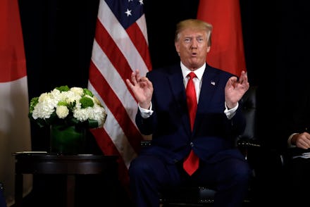 President Donald Trump talks while meeting with Japanese Prime Minister Shinzo Abe at the InterConti...