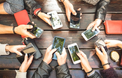 People group having addicted fun together using smartphones - Detail of hands sharing content on soc...