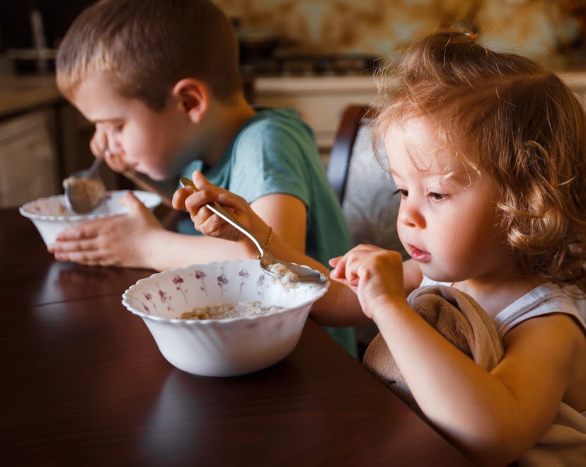 Children eating soup at home in a story about recipes for sick kids