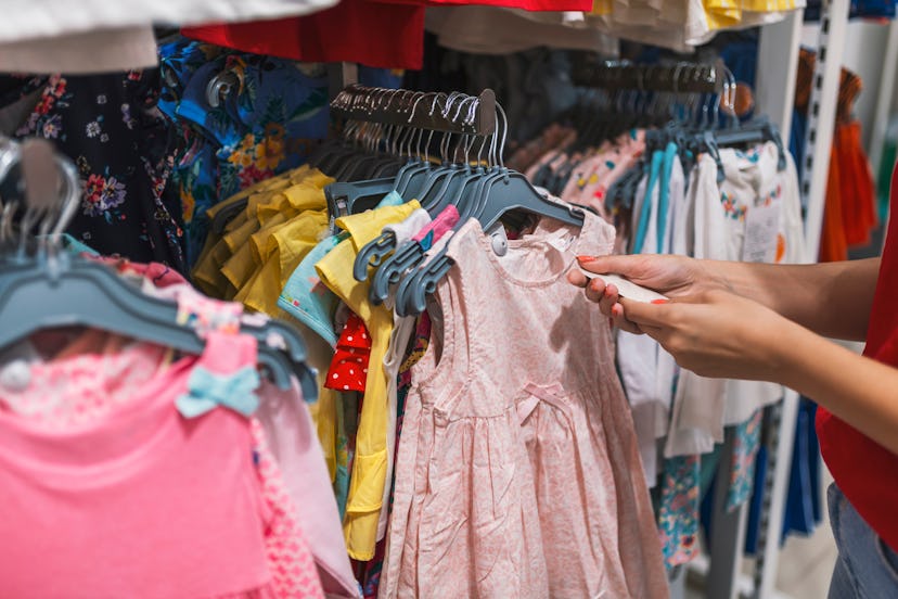 Picture showing happy woman shopping for clothes. Beautiful businesswoman buying clothes. Shopping, ...