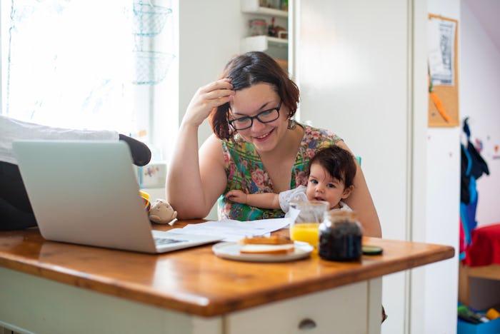 Working mom with baby in a lap