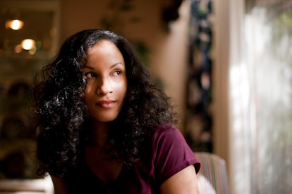 Woman looking out window