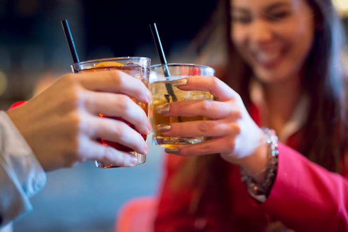 People toasting a cocktail