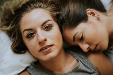 Lesbian couple together in bed