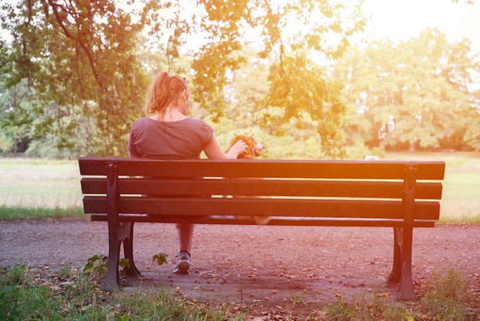 close up on lonely woman on the bench