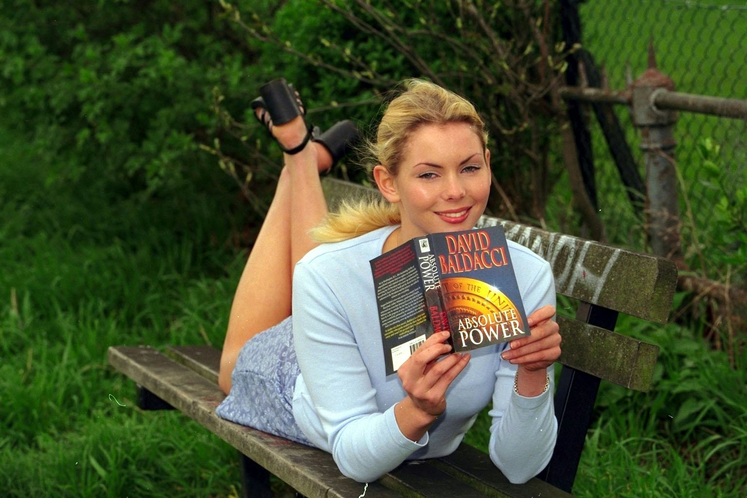 Model Judy Long Poses With The Paperback Of Absolute Power By David Baldacci For A Scottish Daily Ma...