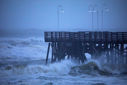Waves strike the Main Street Pier as Hurricane Dorian passes 90 miles offshore in Daytona Beach, Flo...