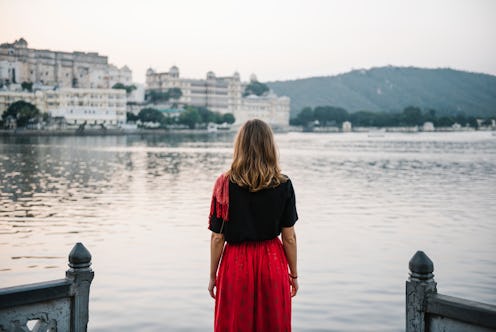 Western woman enjoying a view of Taj Lake in Udaipur