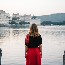 Western woman enjoying a view of Taj Lake in Udaipur