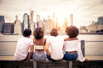 Group of afroamerican friends bonding in Manhattan, New York - Young adults having fun outdoors, con...