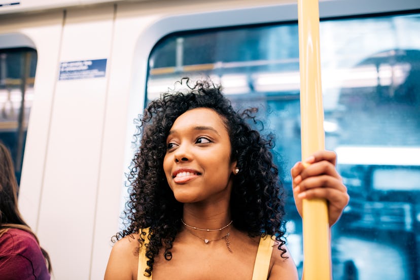 Happy black woman on London underground