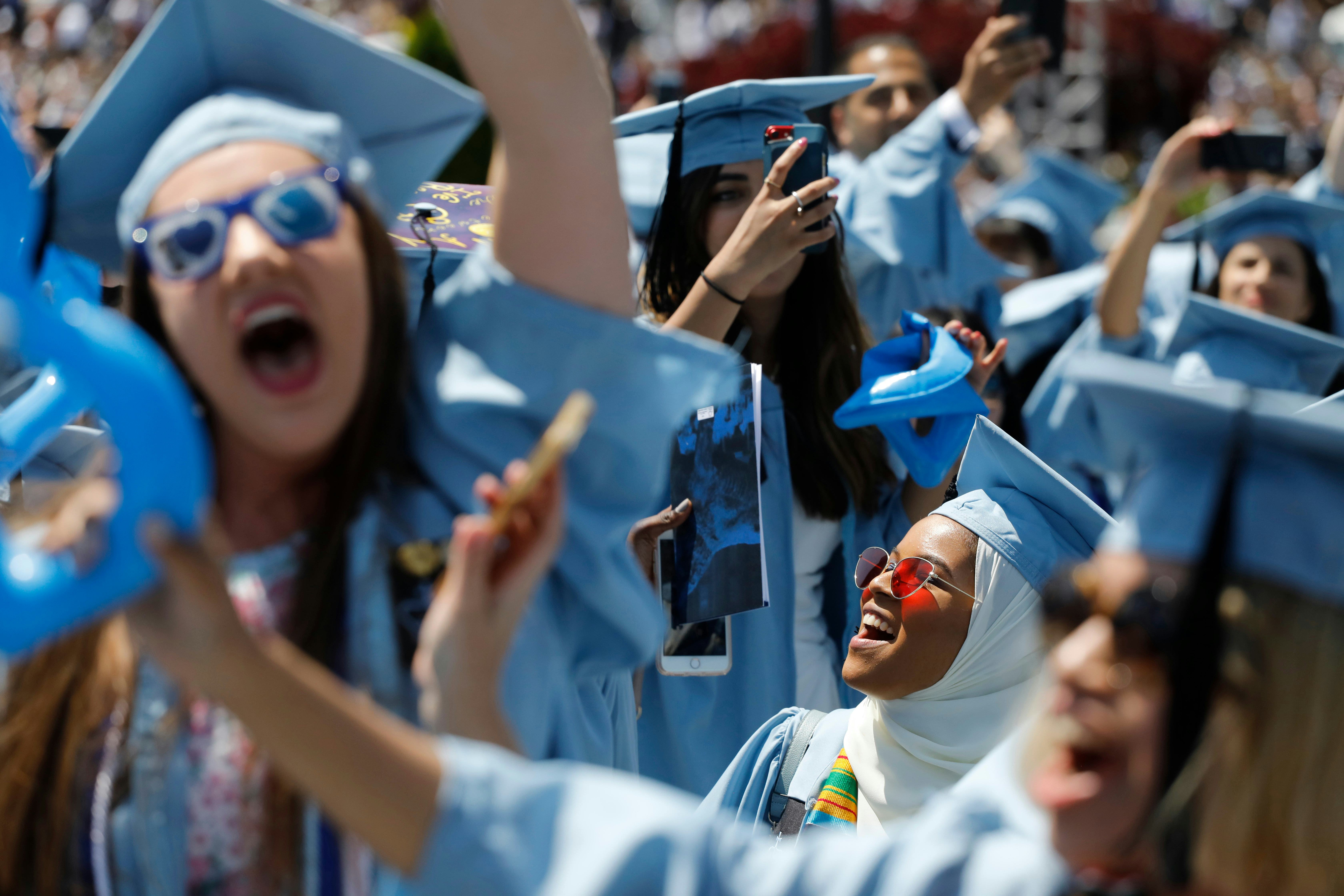 Nehad Abdelgadir, right, cheers with fellow Barnard College students as they participate in Columbia...