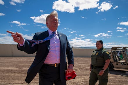 President Donald Trump speaks as he visits a new section of the border wall with Mexico in Calexico,...