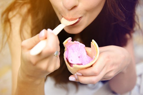 Happy girl eating ice cream.