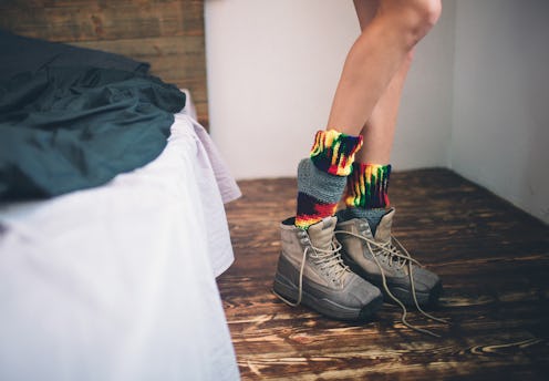 Close-up, female legs. Young woman dress up shoes