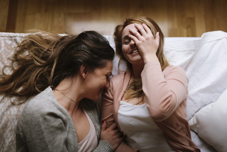 Gorgeous friends having fun in the bedroom. Friendship concept.