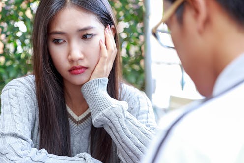 women sad with love in coffee cafe