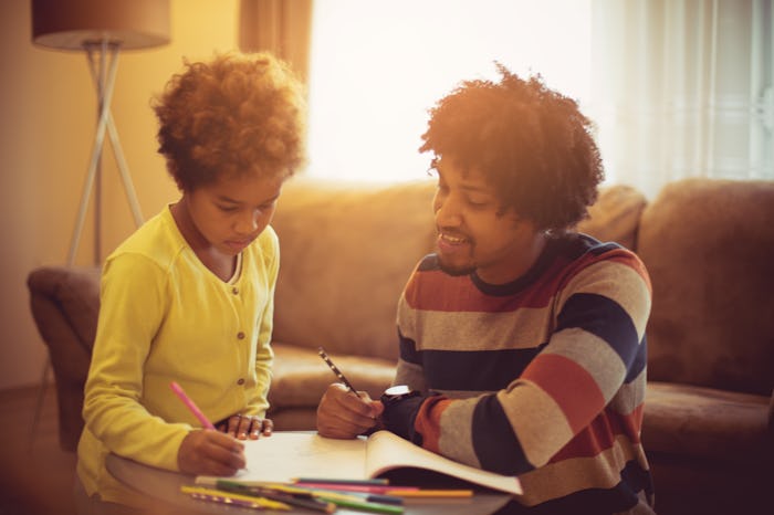 dad helping daughter with homework