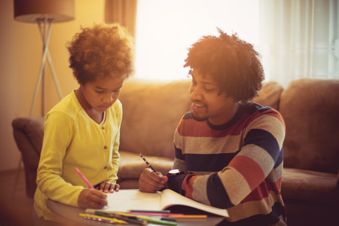 dad helping daughter with homework