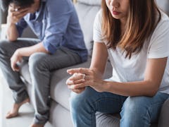 Frustrated sad wife taking off the wedding ring, Young couple breaking up divorce concept