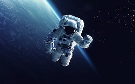 Astronaut at spacewalk. Cosmic art, science fiction wallpaper. Beauty of deep space. Billions of gal...