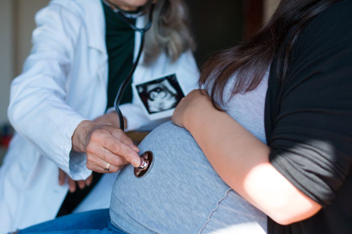 Doctor examining a pregnant woman