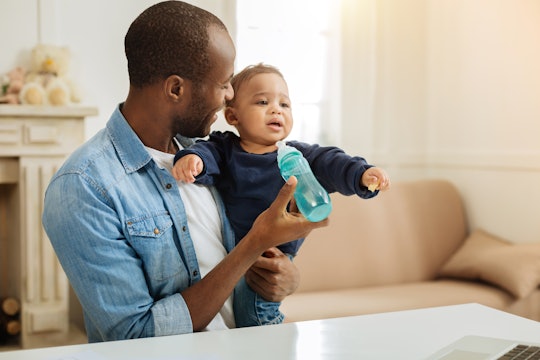 Giving baby a bottle is another way dads can help breastfeeding moms wean their baby.