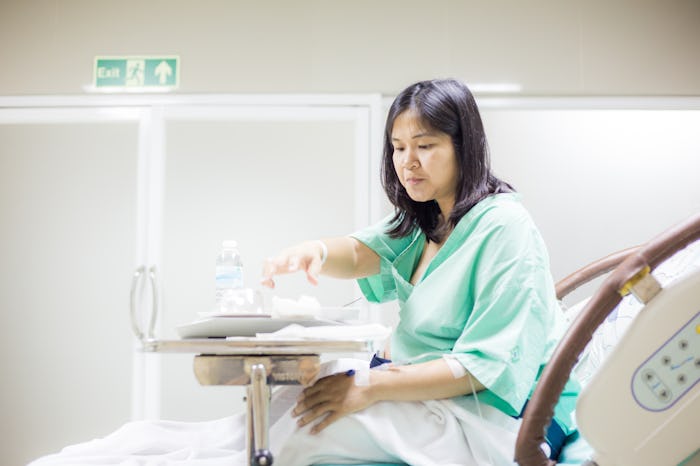 pregnant woman in hospital bed with food