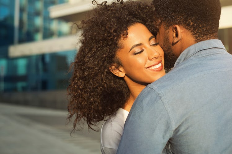 Romantic couple walking in the city, enjoying company of each other