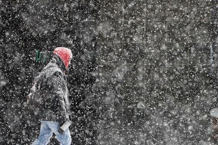 A pedestrian walks during a winter snowstorm in Philadelphia