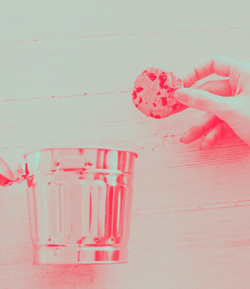 hand throwing cookie into a trash can, metaphor about website cookies and user tracking technologies