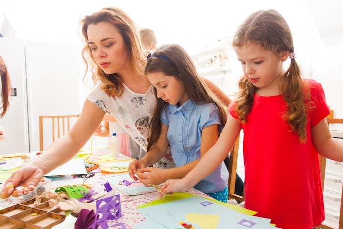 a mom doing crafts with her kids