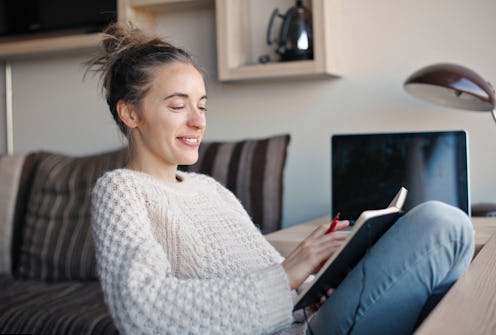 woman writes in a notebook