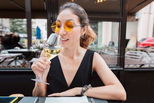 young asian customer woman drinking white wine