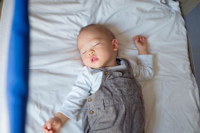 baby boy sleeping in a crib