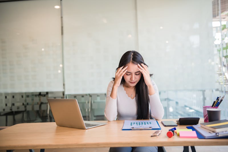 Woman stress at work, office