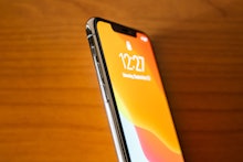 In this photo a new iPhone 11 Pro Max smartphone is seen on a wooden top.