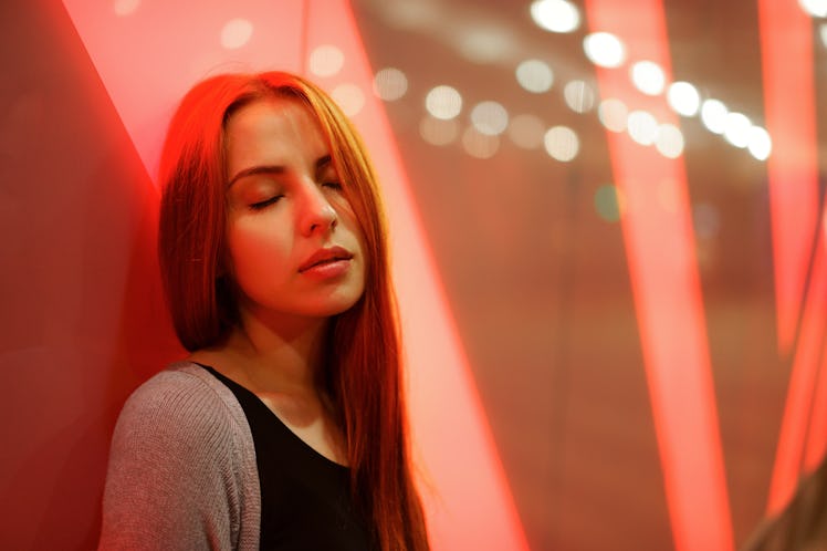 redheaded girl on the background of the night city