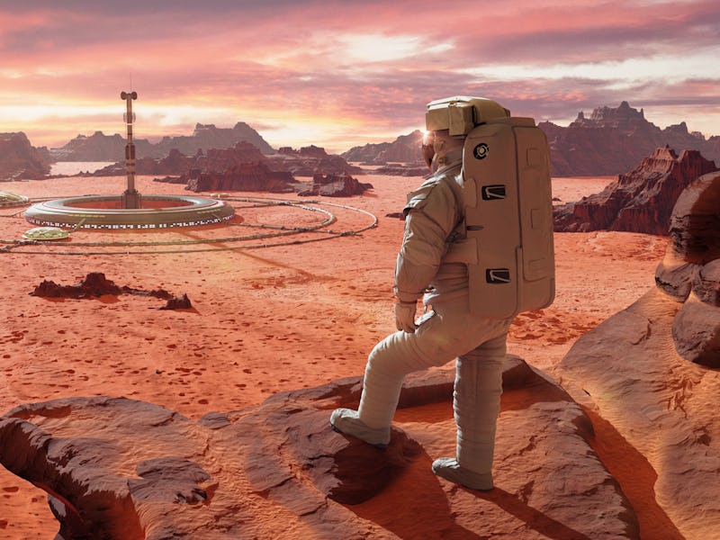 astronaut on planet Mars, looking at a martian colony (3d science illustration)