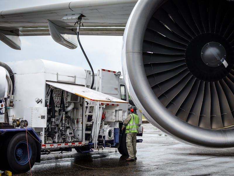 Aircraft refueling by high pressure fuel supply truck.Passenger jet airplane refuel from supply truc...