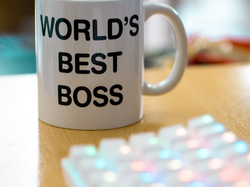 world's best boss mug near to colourful rgb keyboard