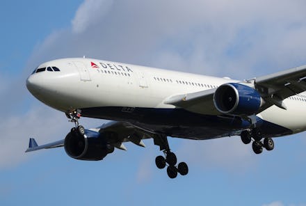 A Delta Air Lines N852NW (Airbus A330 - MSN 614) plane as it lands at London Heathrow airport in blu...