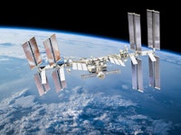 International space station on orbit of Earth planet. ISS. Dark background. Elements of this image f...