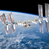 International space station on orbit of Earth planet. ISS. Dark background. Elements of this image f...