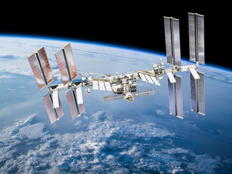 International space station on orbit of Earth planet. ISS. Dark background. Elements of this image f...