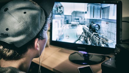 Teenager Playing Call of Duty Video Game on Xbox One