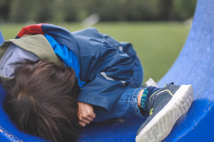 Little sad boy at public park