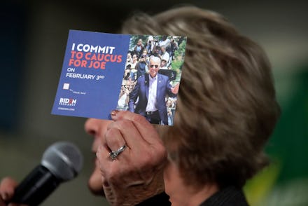 Former First Lady of Iowa Christie Vilsack holds up a card encouraging people to caucus for Democrat...