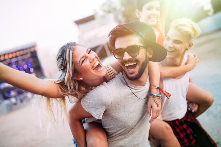 Group of friends having fun time at music festival